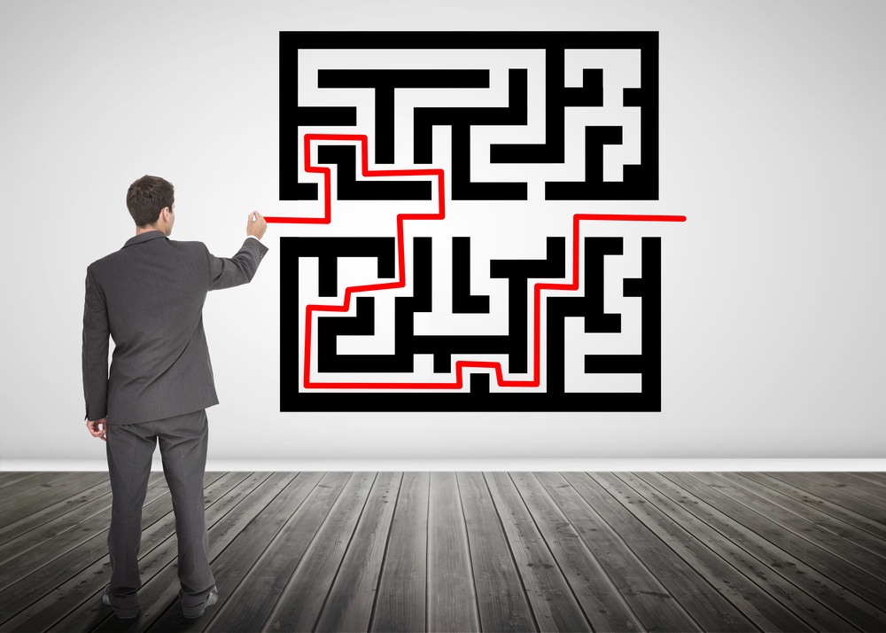Businessman drawing a red line through qr code in empty room.jpeg