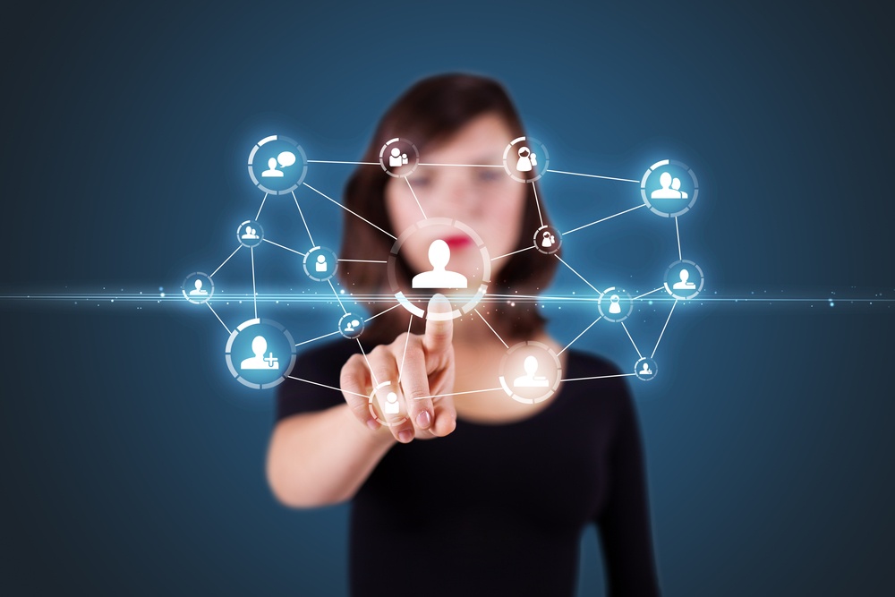 Businesswoman pressing modern social buttons on a virtual background.jpeg