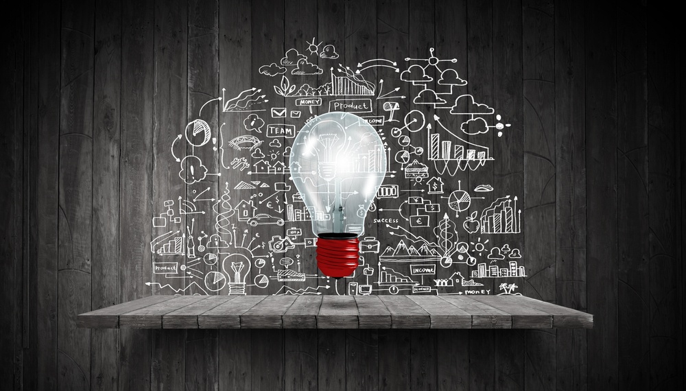 Light bulb and drawing business strategy at background.jpeg