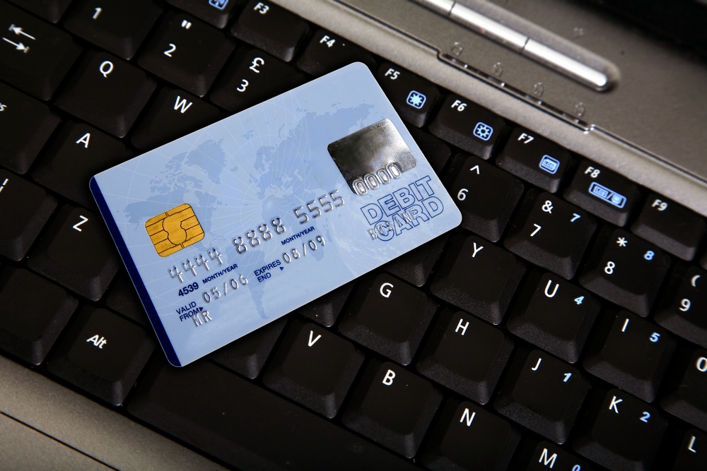 credit card over a computer keyboard - note the design of the card is my own.jpeg
